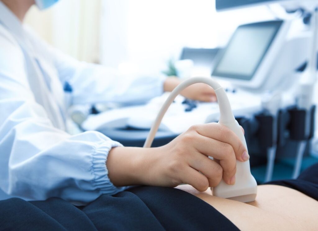 a person using an ultrasound device