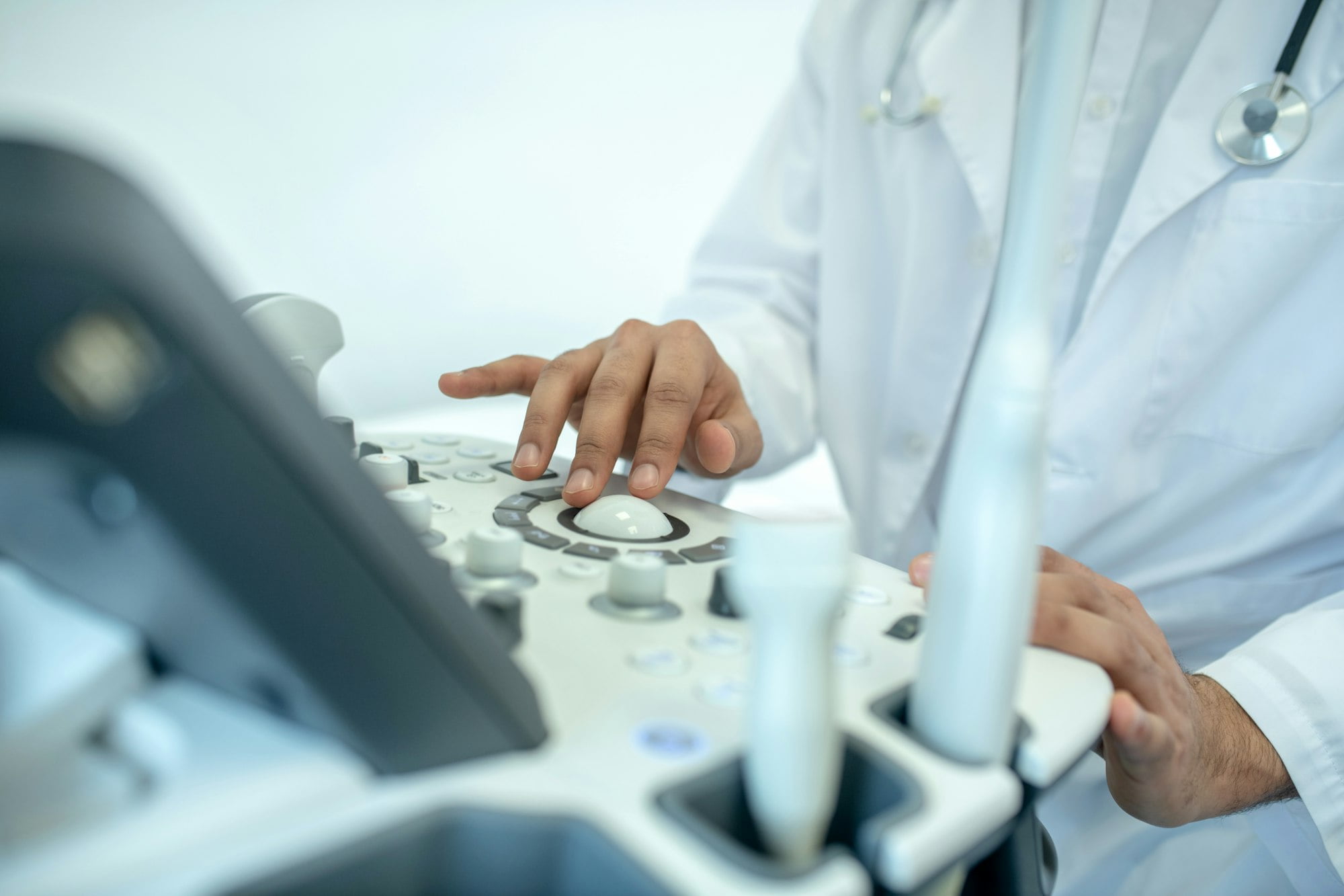 a close-up of a doctor's hand on a machine